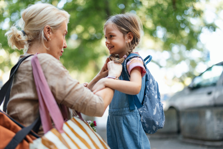 A touching moment as a mother helps her daughter get ready for school