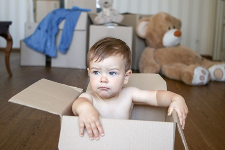 Toddler sitting in box